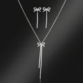 Setje "strik" ketting met oorbellen in goud en zilverkleur